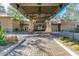 The main entrance to the building features a covered portico and desert landscaping at 7762 E Russell Cir, Mesa, AZ 85207