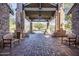 Picturesque entrance area with stone columns, pavers, and benches at 7762 E Russell Cir, Mesa, AZ 85207