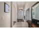 Bright entryway featuring tile flooring and an elegant chandelier at 7762 E Russell Cir, Mesa, AZ 85207