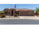 Charming single-story home featuring a spacious three car garage and desert landscaping at 7762 E Russell Cir, Mesa, AZ 85207
