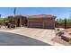 Expansive driveway and three-car garage offer ample parking at 7762 E Russell Cir, Mesa, AZ 85207