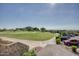 Expansive view of the golf course, parking lot, and desert landscaping at 7762 E Russell Cir, Mesa, AZ 85207