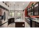 Modern kitchen featuring stainless steel appliances, a breakfast bar, and ample cabinet space at 7762 E Russell Cir, Mesa, AZ 85207