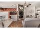 Open concept kitchen and living room with modern fixtures and ample space for entertaining at 7762 E Russell Cir, Mesa, AZ 85207
