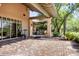 Inviting outdoor patio with fitness equipment and lush greenery at 7762 E Russell Cir, Mesa, AZ 85207