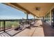 Relaxing outdoor patio seating area with comfortable chairs and scenic golf course views at 7762 E Russell Cir, Mesa, AZ 85207