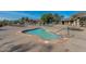 Relaxing community pool area with a pool, lounge chairs, and desert landscape views at 7762 E Russell Cir, Mesa, AZ 85207