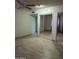 Spacious bedroom with a ceiling fan and large mirror closet doors at 8110 N 31St Dr, Phoenix, AZ 85051