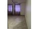 Bedroom features tile flooring, a ceiling fan, and windows with purple curtains at 8110 N 31St Dr, Phoenix, AZ 85051