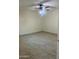 This is a spacious bedroom with tile flooring and a ceiling fan at 8110 N 31St Dr, Phoenix, AZ 85051