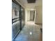 Hallway with tile flooring, slider and neutral walls, connecting rooms for a smooth flow at 8110 N 31St Dr, Phoenix, AZ 85051