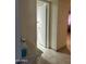 Hallway showing the tile floor and open door to the bathroom at 8110 N 31St Dr, Phoenix, AZ 85051