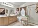 Bright bathroom featuring a double vanity, shower, and bathtub for convenience at 871 N Granada Dr, Chandler, AZ 85226