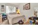 Cozy bedroom featuring natural light, neutral tones, and unique macrame decor at 871 N Granada Dr, Chandler, AZ 85226