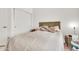 Simple bedroom with a bed, white walls, and minimalist decor at 871 N Granada Dr, Chandler, AZ 85226