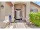 Welcoming front porch with a charming 'Welcome' sign and space for decorative plants at 871 N Granada Dr, Chandler, AZ 85226