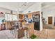Kitchen featuring an island with chairs, tile flooring, and stainless steel appliances at 871 N Granada Dr, Chandler, AZ 85226
