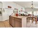 Bright kitchen featuring an island, tile flooring, and an open layout at 871 N Granada Dr, Chandler, AZ 85226