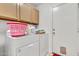 Functional laundry room with washer, dryer, storage cabinets, and ample space at 871 N Granada Dr, Chandler, AZ 85226