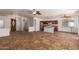 Open living space featuring tile flooring, ceiling fans, and a kitchen view at 9563 E Keats Ave, Mesa, AZ 85209