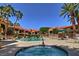Relaxing community pool and hot tub surrounded by palm trees and comfortable lounge chairs at 9707 E Mountain View Rd # 1408, Scottsdale, AZ 85258