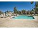 Community pool with lounge chairs and well-maintained landscaping for a relaxing environment at 9707 E Mountain View Rd # 1408, Scottsdale, AZ 85258
