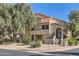Charming condo featuring stucco siding, red tile roof, desert landscaping, and a welcoming entryway at 9707 E Mountain View Rd # 1408, Scottsdale, AZ 85258
