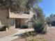 Charming condo exterior with mature trees and a meticulously maintained desert landscape provides curb appeal at 9707 E Mountain View Rd # 1408, Scottsdale, AZ 85258