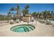 Relaxing hot tub area with nearby seating and community amenities under a sunny sky at 9707 E Mountain View Rd # 1408, Scottsdale, AZ 85258