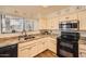 Bright kitchen with granite countertops, modern appliances, and white cabinets for a clean, stylish look at 9707 E Mountain View Rd # 1408, Scottsdale, AZ 85258