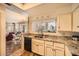 Well-lit kitchen showcasing granite countertops, stainless steel appliances, and ample cabinet space at 9707 E Mountain View Rd # 1408, Scottsdale, AZ 85258
