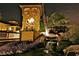 Picturesque view of a building with a waterfall feature at night at 9707 E Mountain View Rd # 1408, Scottsdale, AZ 85258