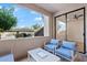 Balcony with contemporary seating, privacy wall and view of landscaping at 9708 E Via Linda Rd # 1350, Scottsdale, AZ 85258