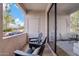Private balcony features comfortable seating and offers a tranquil outdoor retreat, perfect for relaxation at 9708 E Via Linda Rd # 1350, Scottsdale, AZ 85258