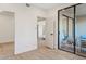 Bright bedroom with a mirrored closet and access to a private balcony for seamless indoor/outdoor living at 9708 E Via Linda Rd # 1350, Scottsdale, AZ 85258
