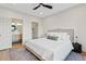 Bedroom featuring hardwood floors, neutral decor and access to ensuite bathroom at 9708 E Via Linda Rd # 1350, Scottsdale, AZ 85258