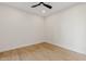 This bedroom features modern ceiling fan, recessed lighting, and stylish wood-look laminate flooring at 9708 E Via Linda Rd # 1350, Scottsdale, AZ 85258