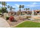 Attractive community amenities include a pool, lounge area, and water feature surrounded by lush landscaping and palm trees at 9708 E Via Linda Rd # 1350, Scottsdale, AZ 85258