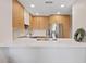 Sleek kitchen featuring stainless steel appliances, quartz countertops, and light wood cabinetry at 9708 E Via Linda Rd # 1350, Scottsdale, AZ 85258