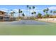 Well-kept tennis courts provide a great recreational option, complemented by palm trees, benches, and outdoor lighting at 9708 E Via Linda Rd # 1350, Scottsdale, AZ 85258