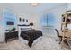 Well-lit bedroom featuring a dedicated desk area and bright, airy feel at 10132 E Ursula Ave, Mesa, AZ 85212