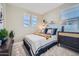 Comfortable bedroom with soft natural light and neutral decor at 10132 E Ursula Ave, Mesa, AZ 85212