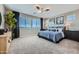 Serene main bedroom featuring a plush bed, ample natural light, and stylish furnishings at 10132 E Ursula Ave, Mesa, AZ 85212