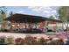 Community pool area with covered seating, lounge chairs and beautiful landscaping at 10132 E Ursula Ave, Mesa, AZ 85212