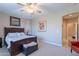Relaxing bedroom with a dark wood furniture and a ceiling fan at 102 W Raven Dr, Chandler, AZ 85286
