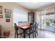 Cozy dining area with a view of the backyard pool through sliding glass doors at 102 W Raven Dr, Chandler, AZ 85286