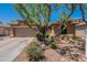 Charming single-story home boasts mature landscaping and a two-car garage at 102 W Raven Dr, Chandler, AZ 85286