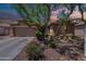 Beautiful single-story home with desert landscaping, a two-car garage, and a warm, inviting facade at 102 W Raven Dr, Chandler, AZ 85286