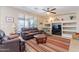 Comfortable living room with plush seating, built-in shelving, and a large window at 102 W Raven Dr, Chandler, AZ 85286