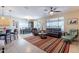 Open-concept living room with tile flooring, neutral tones, and plenty of natural light at 102 W Raven Dr, Chandler, AZ 85286